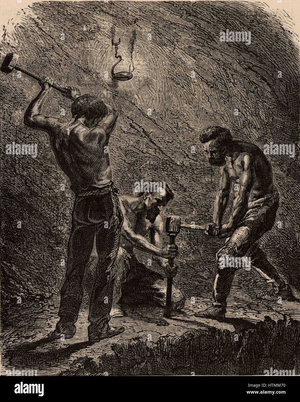 Cornish miners boring a hole to take a charge of explosive. One miner holds the metal borer upright and the two strikers hit it with sledge hammers until the hole has been made. Cornwall, England. From 'Underground Life; or, Mines and Miners' by Louis Sim Stock Photo