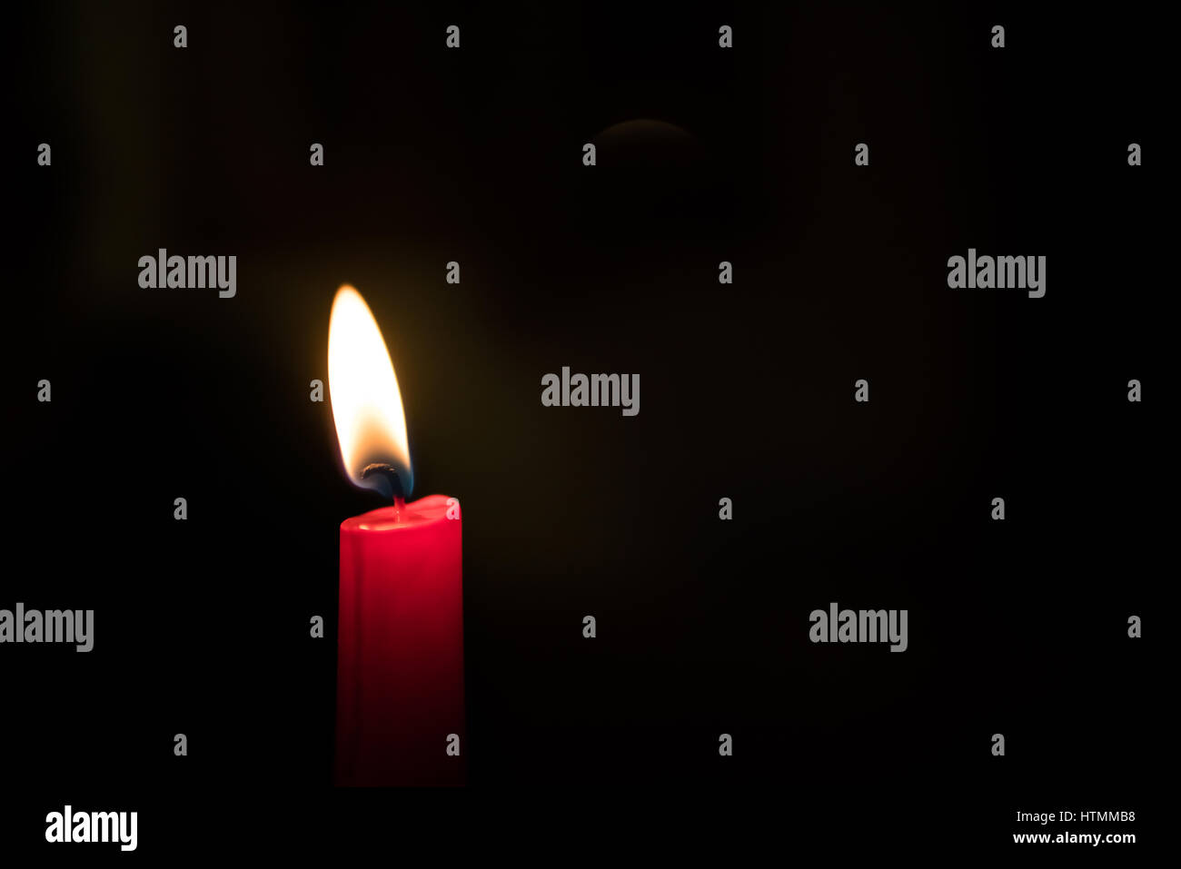 Closeup of burning candle on black background Stock Photo - Alamy
