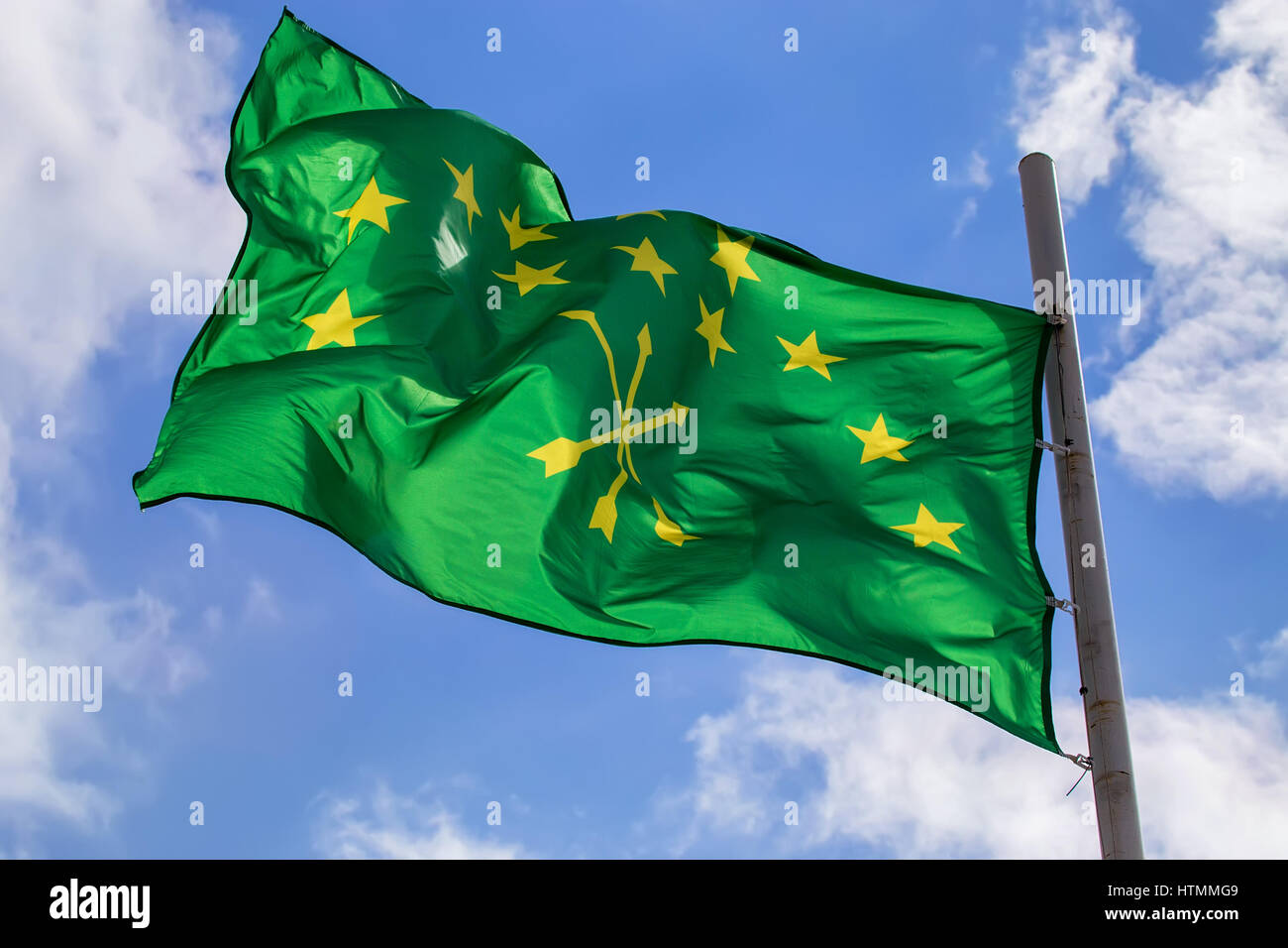 Beautiful waving flag of Adygea on sky background Stock Photo