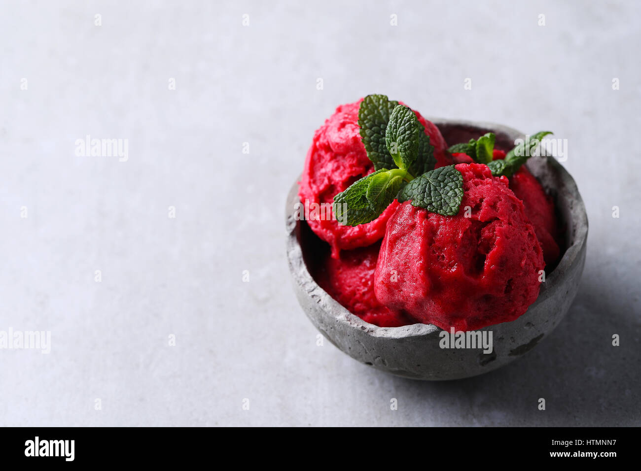 Ice cream. Delicious, strawberry gelato in a bowl Stock Photo