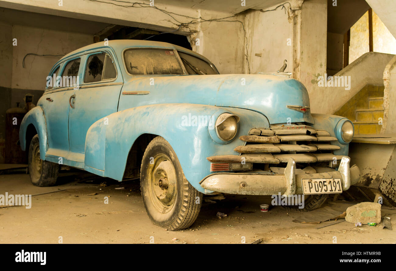 Old Chevrolet in a factory building, Havana, Cuba Stock Photo