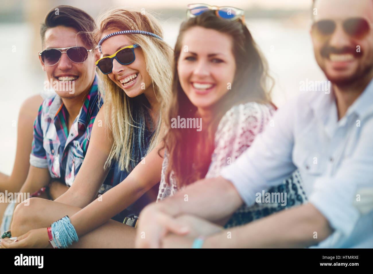 Happy group of young people having fun and enjoying festival in summer Stock Photo