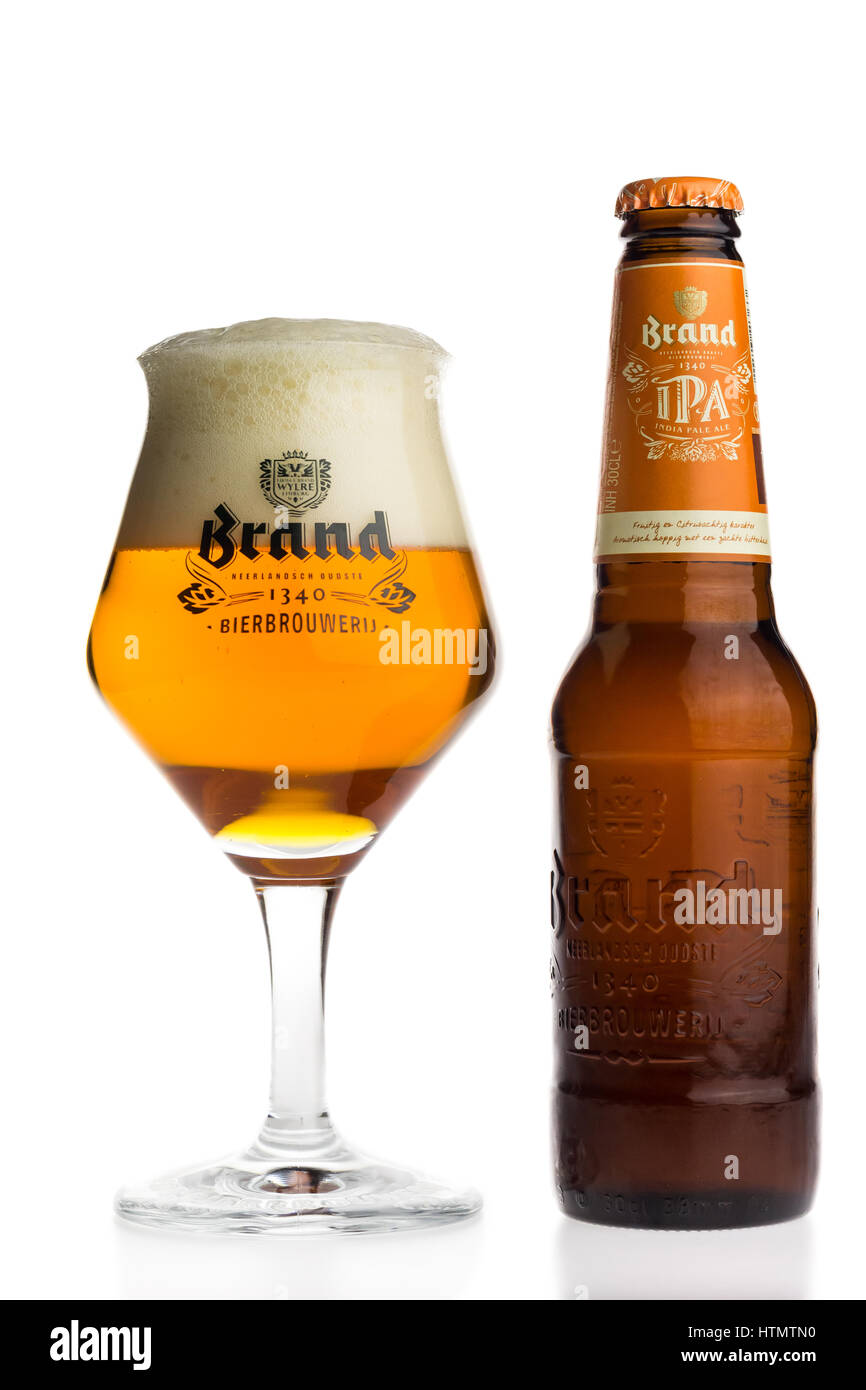 Bottle and glass of Dutch Brand IPA beer isolated on a white background