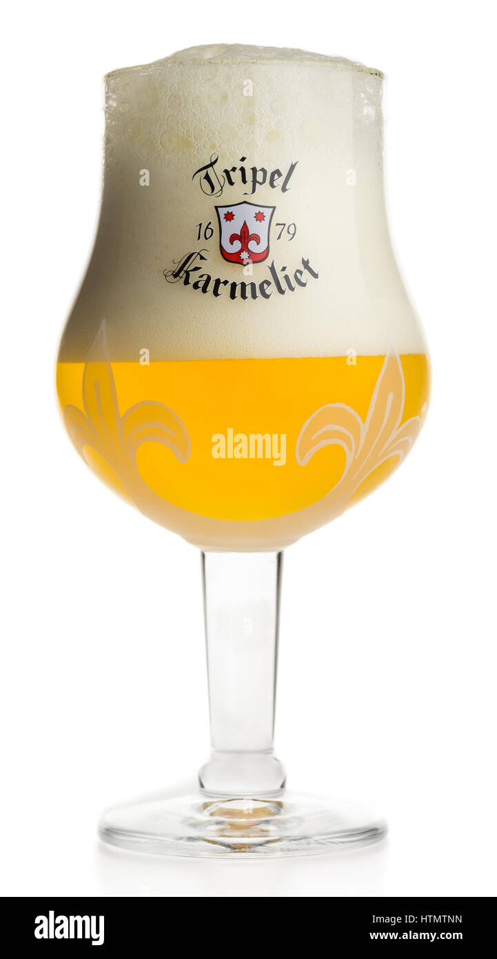 Glass of Tripel Karmeliet beer isolated on a white background Stock Photo -  Alamy