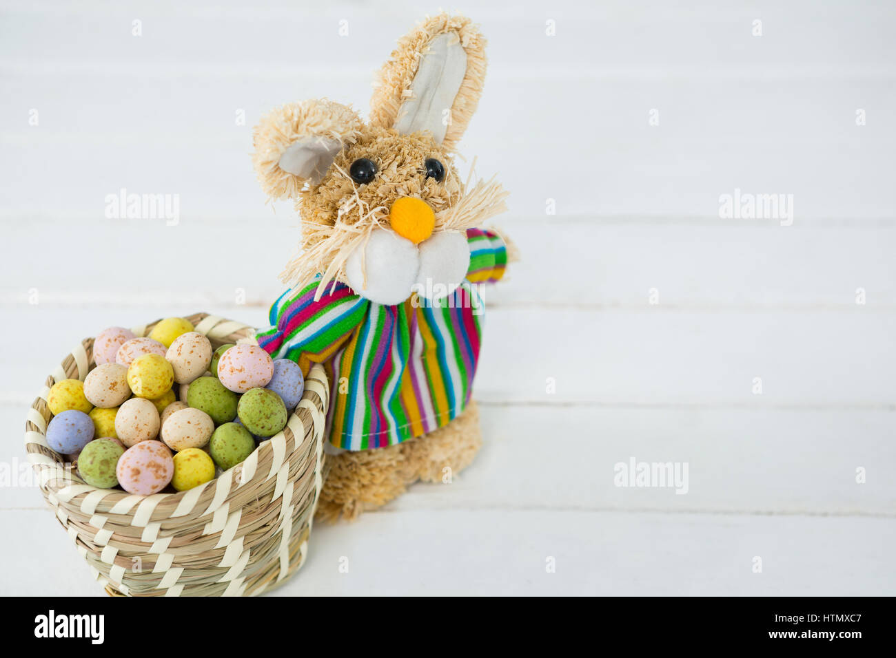 Basket with Easter eggs and Easter bunny on white background Stock ...
