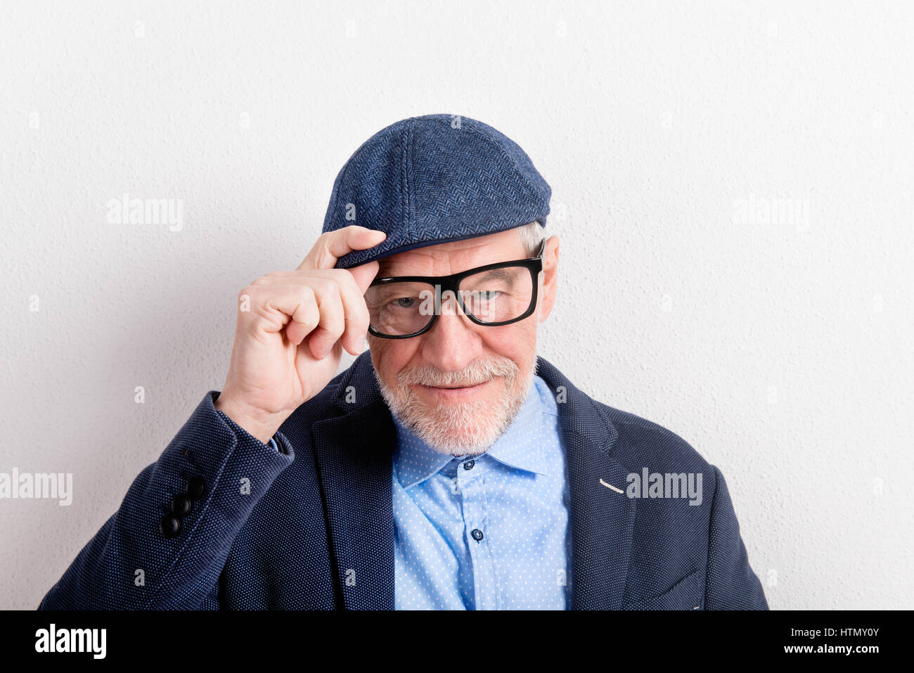 Man in cap blue shirt hi-res stock photography and images - Alamy
