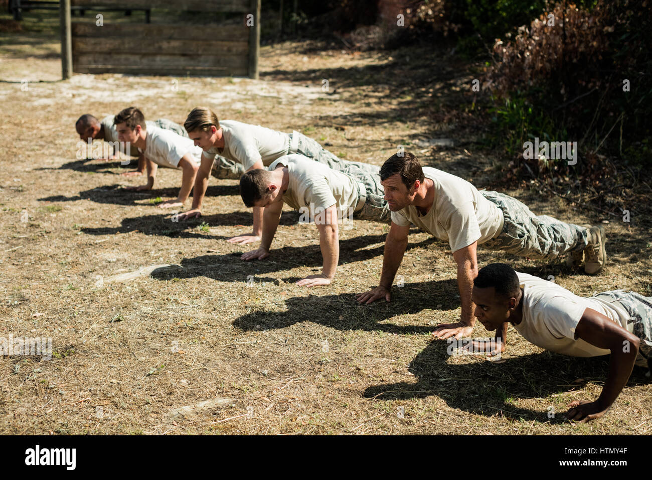 Soldiers performing pushup exercise in boot camp Stock Photo