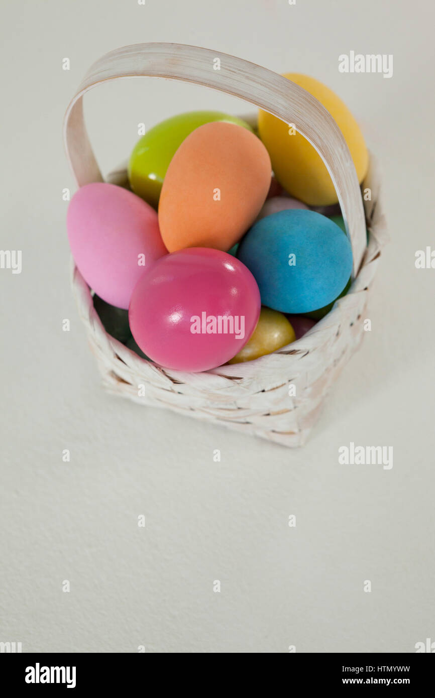 Various Easter eggs in wicker basket on white background Stock Photo ...