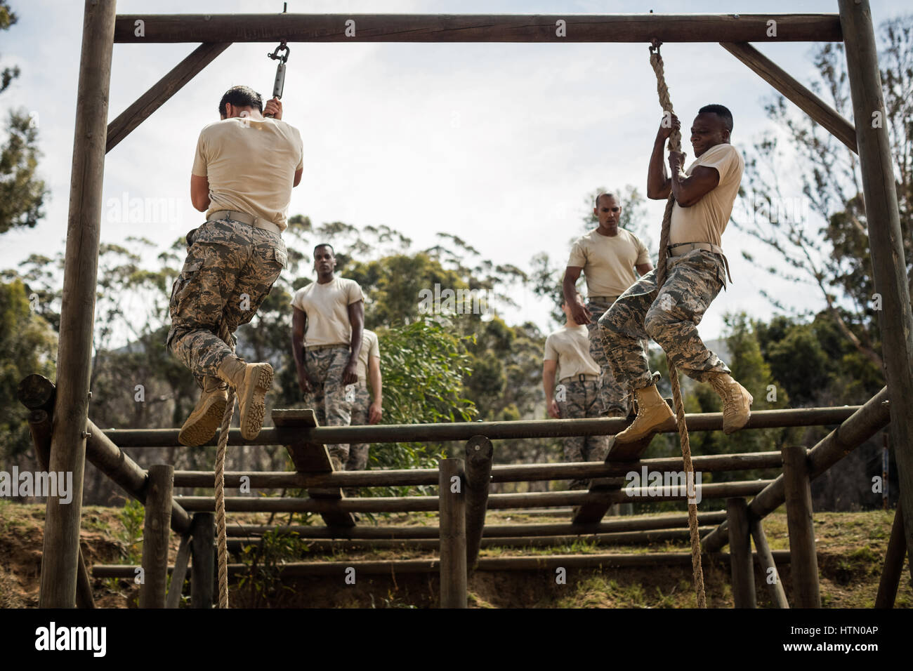 Military soldiers training rope climbing at boot camp Stock Photo Alamy