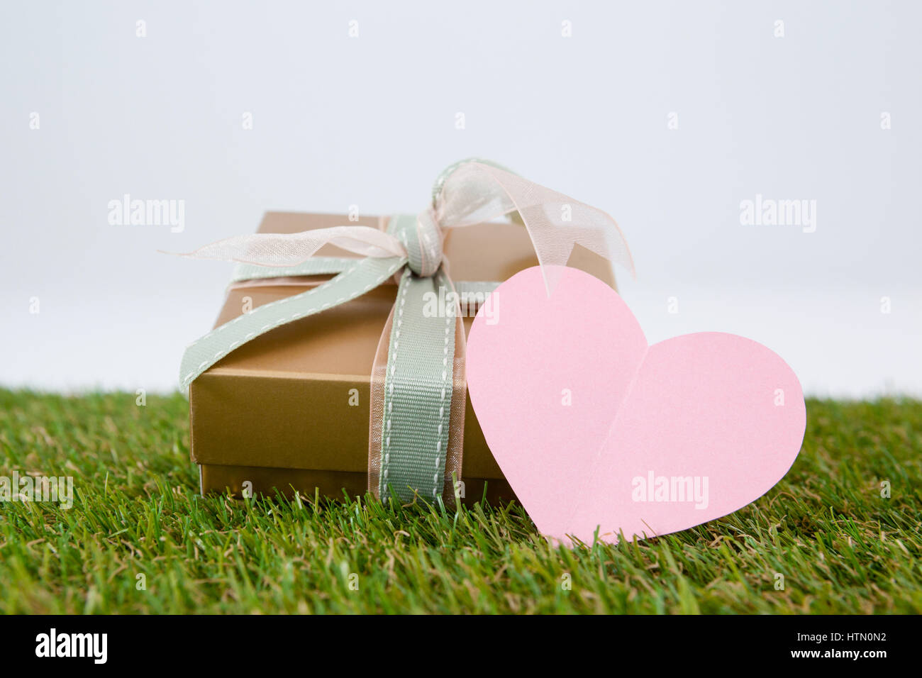 Heart shape card with gift box against white background Stock Photo Alamy