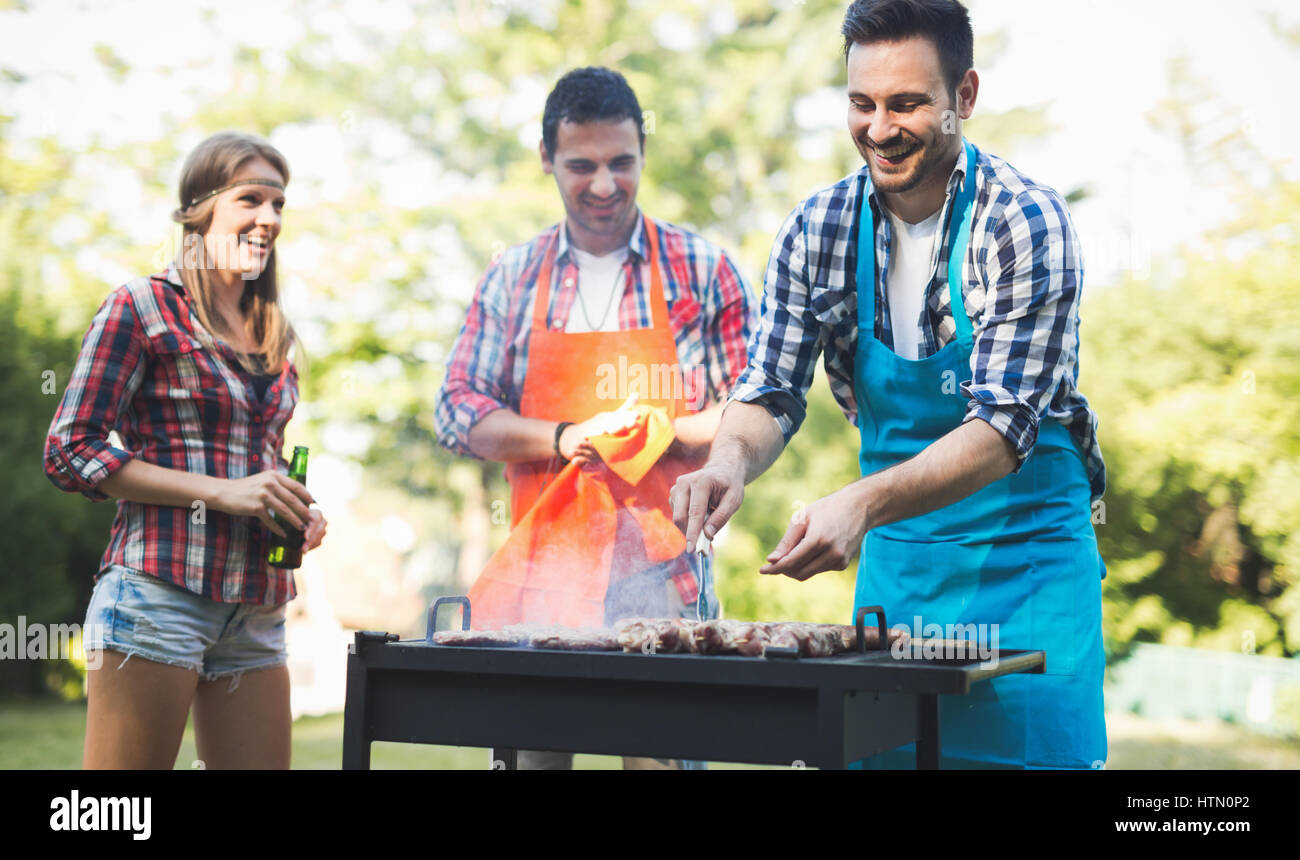 Friends Having A Barbecue Party In Nature While Having A Blast Stock 