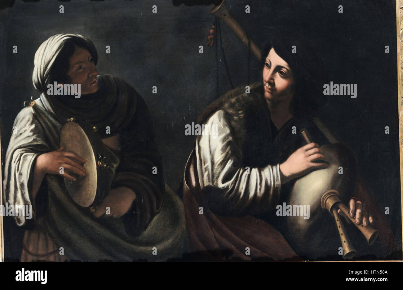 Pietro Paolini - Woman playing a tambourine and woman playing a bagpipe Stock Photo