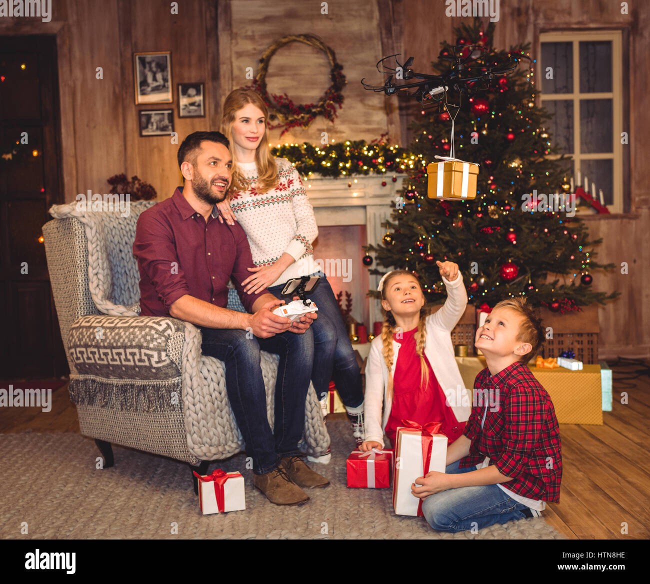 Happy family using hexacopter drone Stock Photo - Alamy