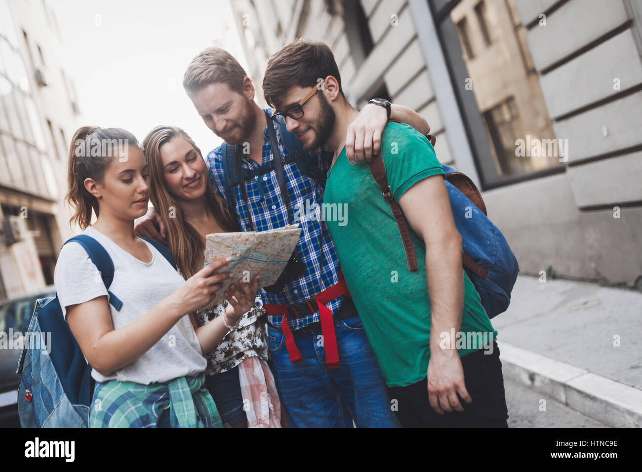 Happy tourists travelling and sightseeing city Stock Photo