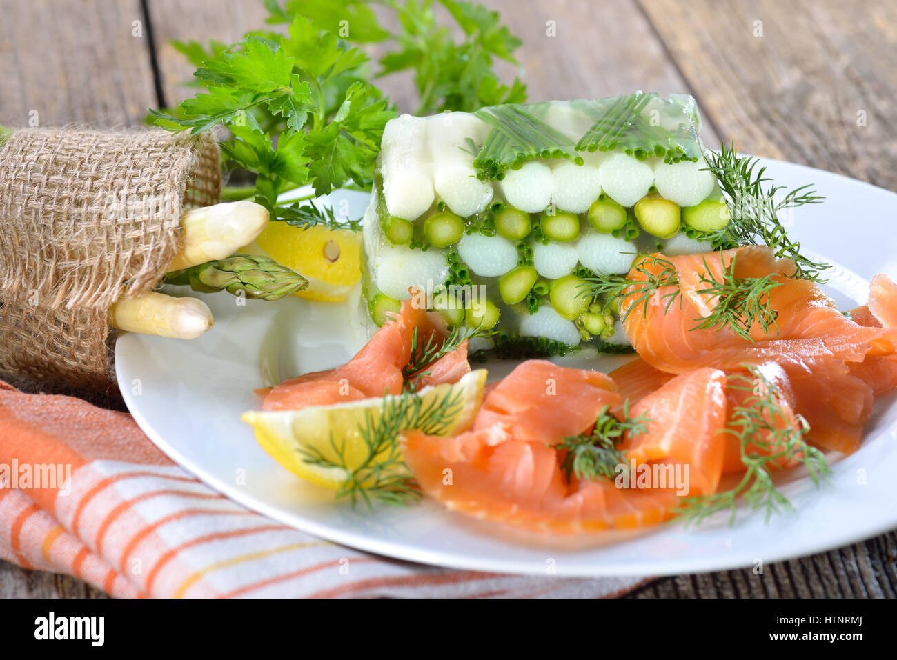 Asparagus jelly with fresh white and green asparagus and chives, served ...