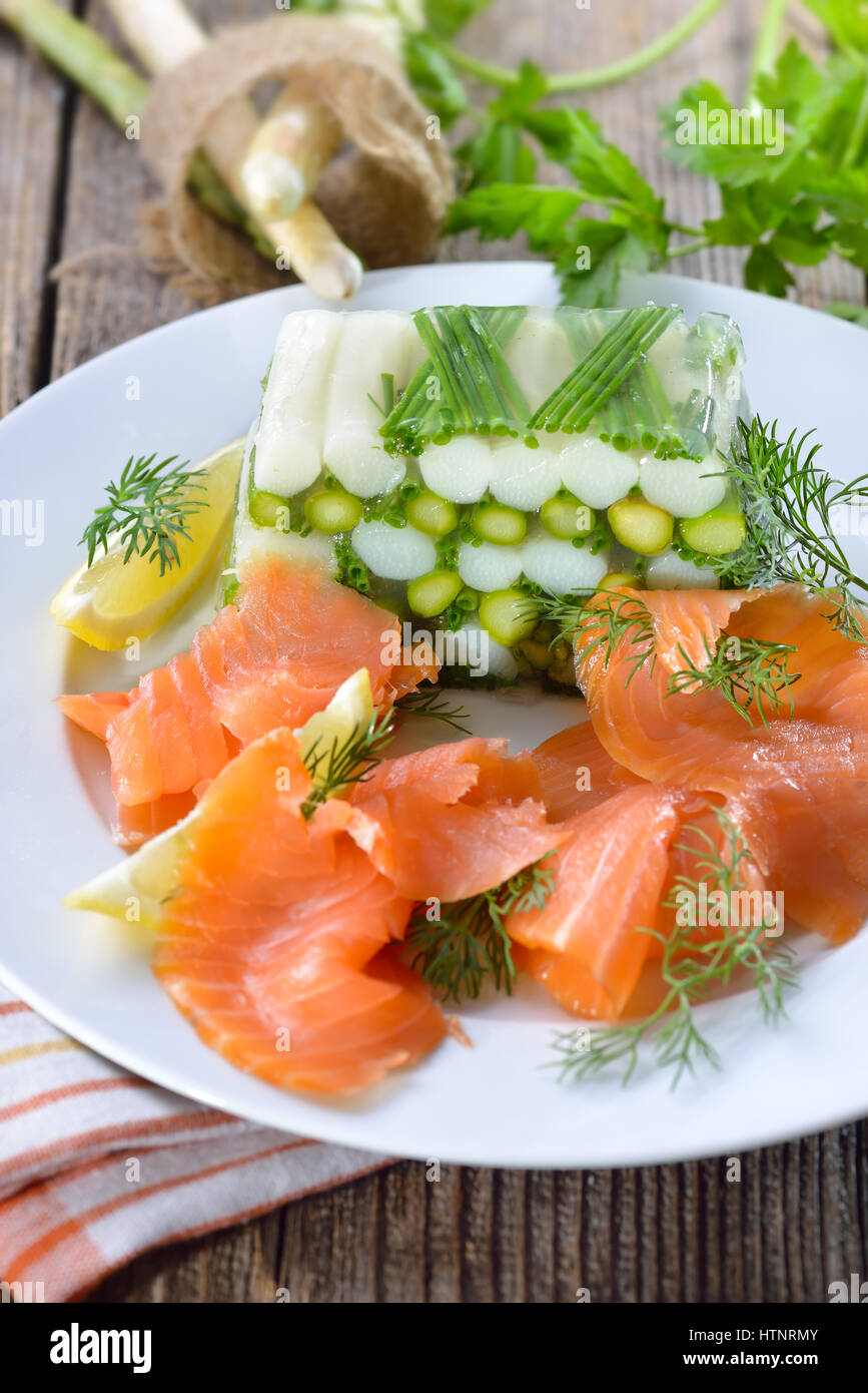 Asparagus jelly with fresh white and green asparagus and chives, served