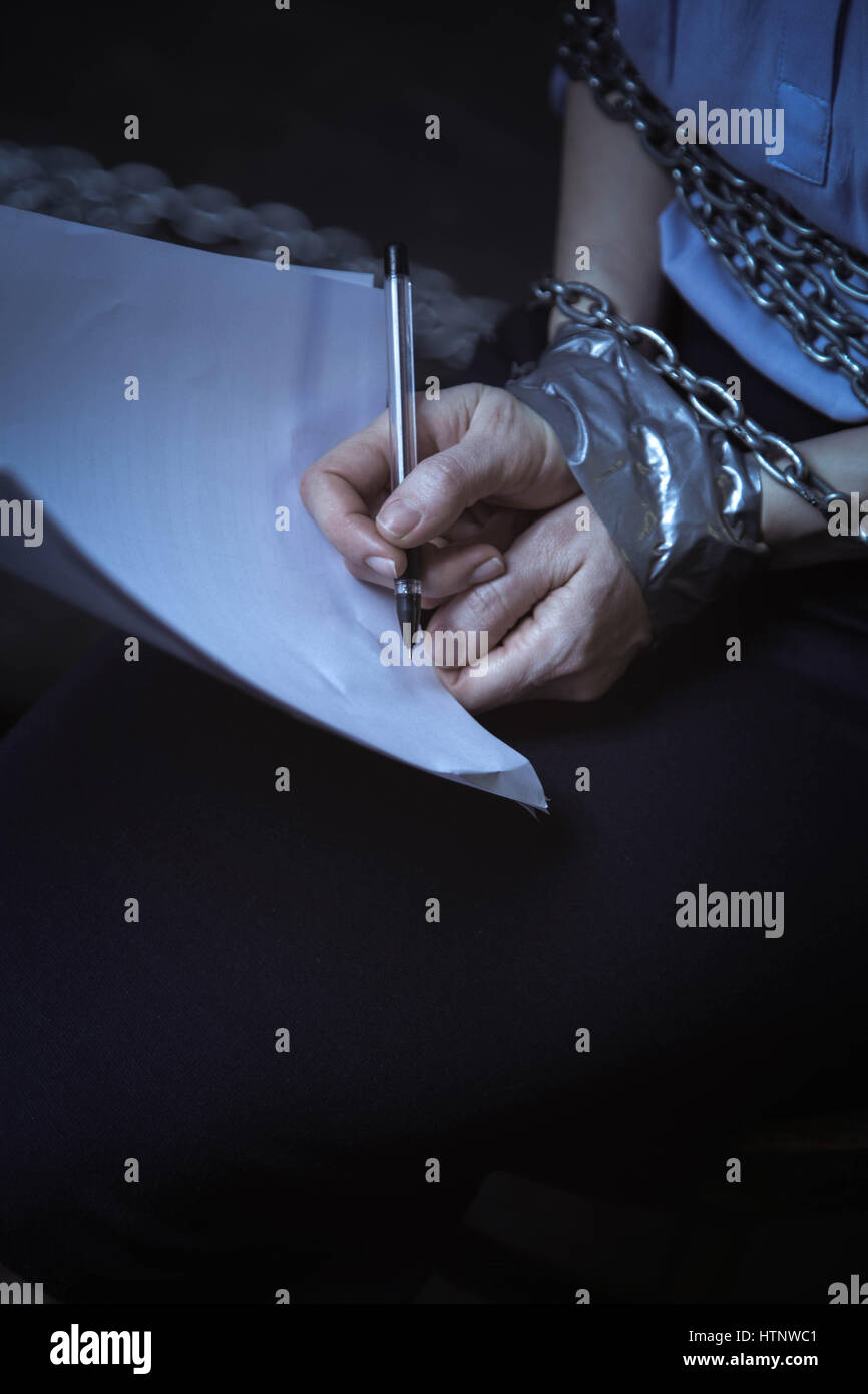 Woman chains trapped hi-res stock photography and images - Alamy