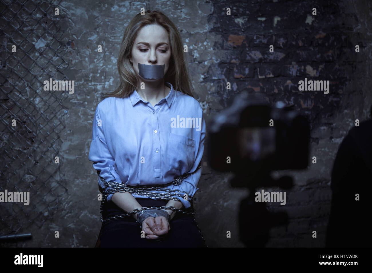 Woman Trapped In Chains. Photography Symbolizing Captivity Or Violence  Against Woman. Stock Photo, Picture and Royalty Free Image. Image 146416623.