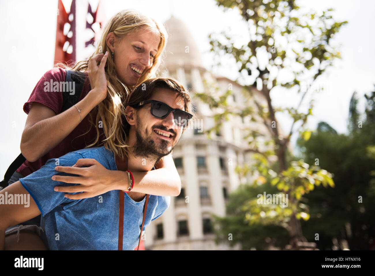 Sweet couple piggyback ride togetherness Stock Photo - Alamy