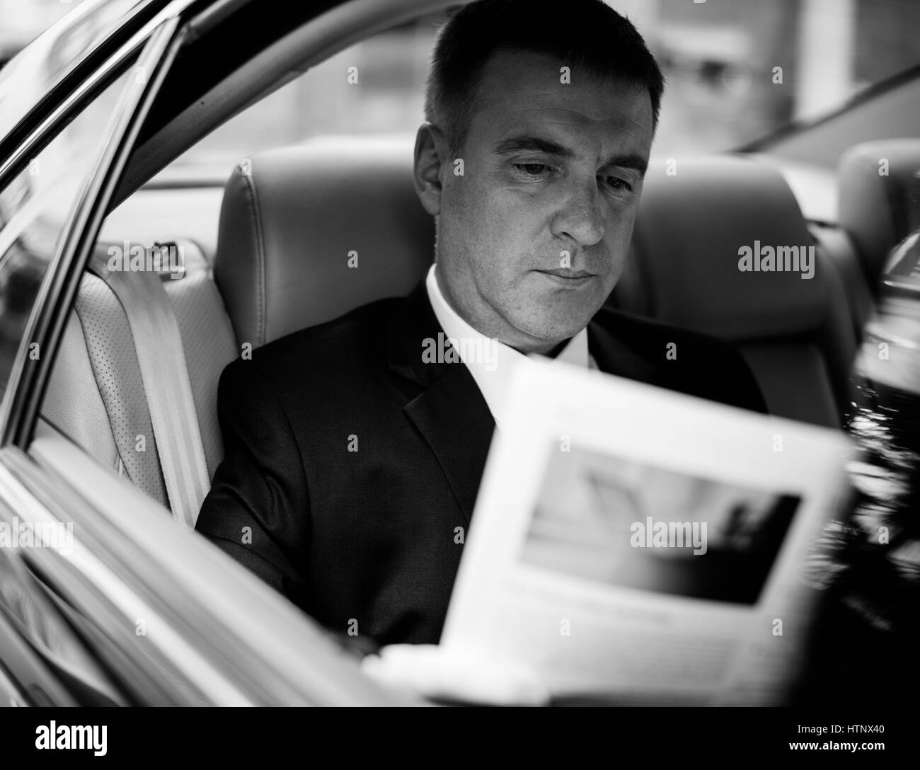 Businessman Working Busy Car Inside Stock Photo