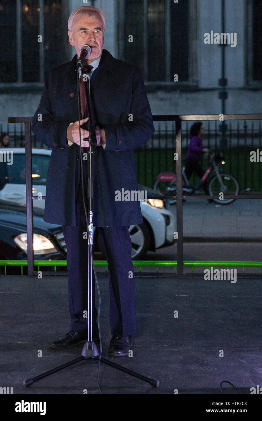 London, UK. 13th March, 2017. John McDonnell, Shadow Chancellor, addresses a protest in Parliament Square in defence of EU citizens' right to remain in the UK whilst MPs inside the House of Commons debate and vote on whether or not the Brexit bill should pass unamended back to the House of Lords. Stock Photo