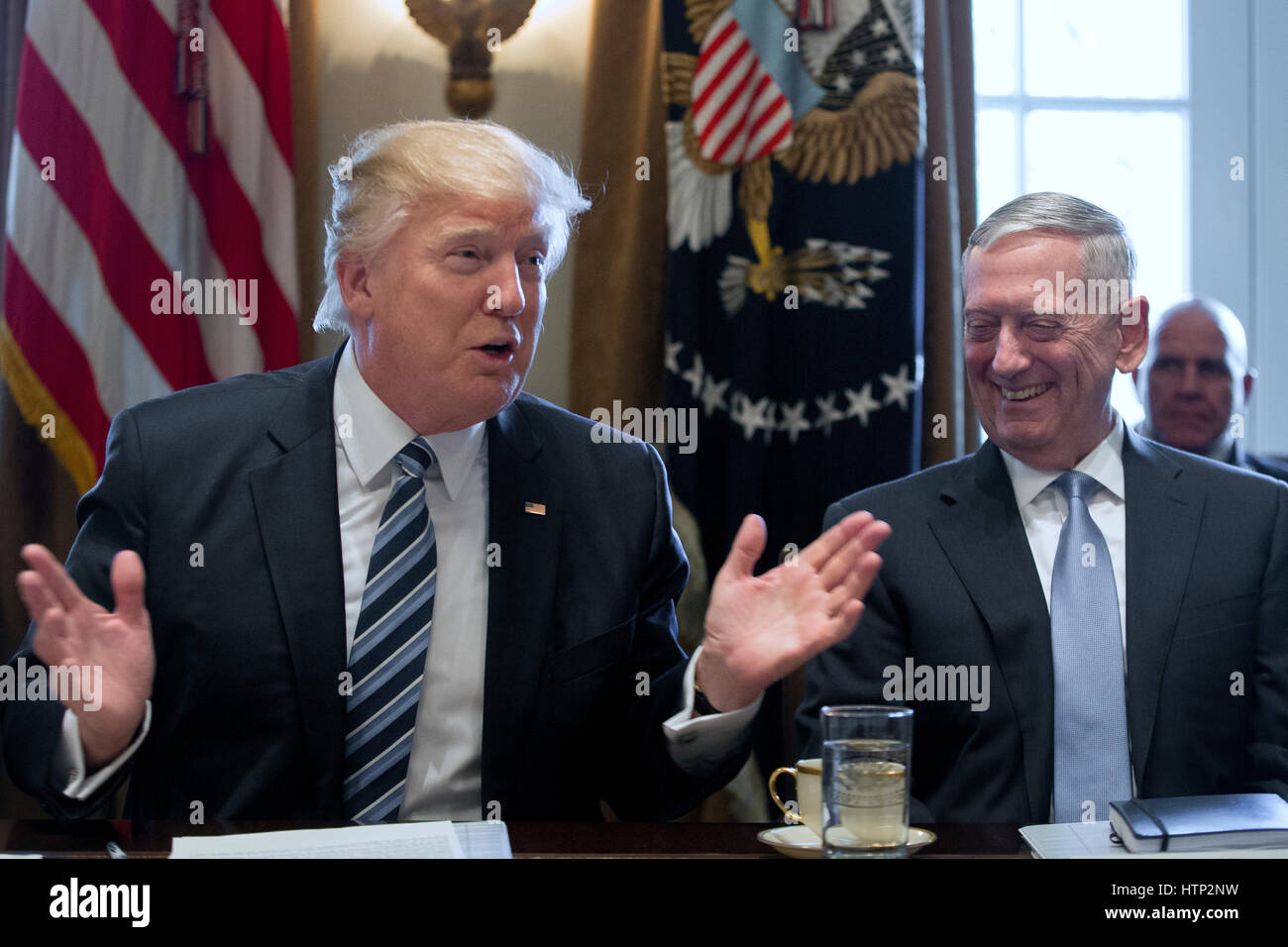 Washington DC, USA 13th March, 2017 US President Donald J Trump (L) speaks beside Secretary of Defense Jim Mattis (R) during a meeting with members of his Cabinet in the Cabinet Room of the White House in Washington, DC, USA, 13 March 2017 Stock Photo