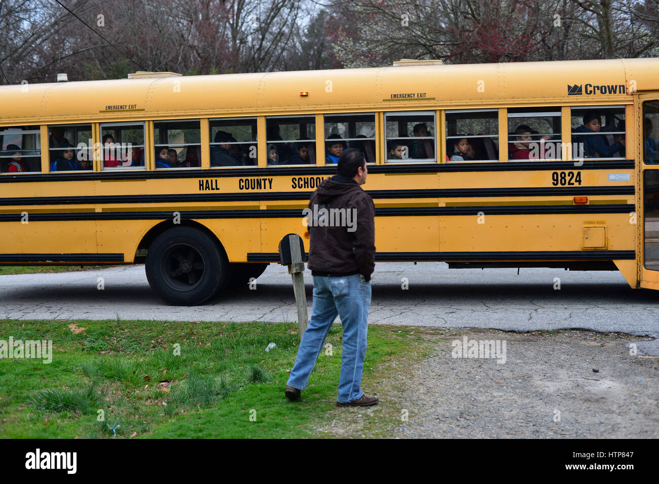 Enrique, an undocumented immigrant from Guanajuato, Mexico, sees his six year old daughter Abigail, a USA citizen, off to school on a bus full of other Latino students in Gainesville, Georgia. The public school district is more than 58 percent Latino, a percentage expected to grow. 28th Feb, 2017. One of the district's newest elementary schools serves almost entirely Latino students.v Credit: Miguel Juarez Lugo/ZUMA Wire/Alamy Live News Stock Photo