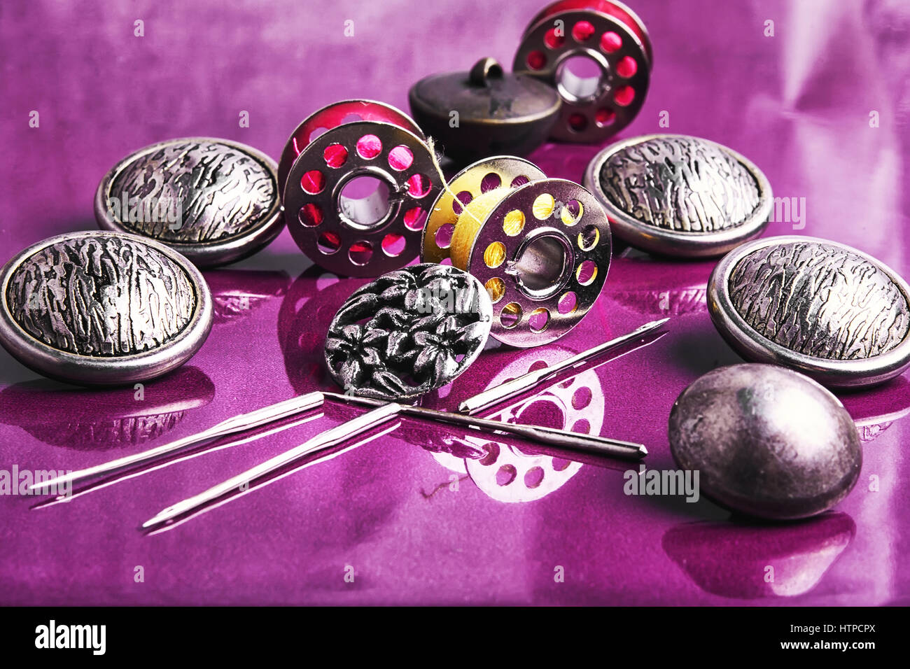 Set of beautiful buttons,sewing needle and bobbin Stock Photo - Alamy