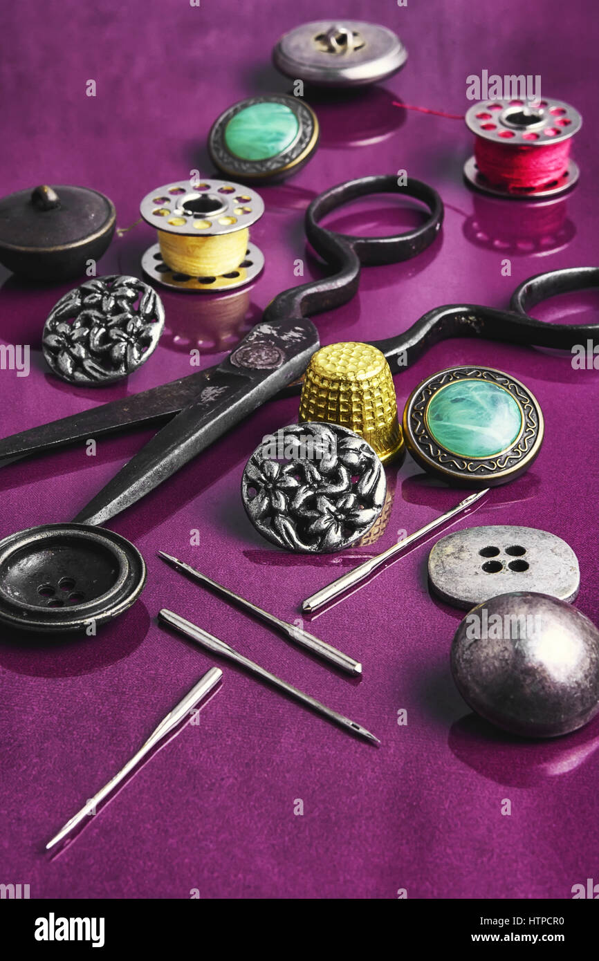 Set of beautiful buttons,sewing needle and bobbin Stock Photo - Alamy