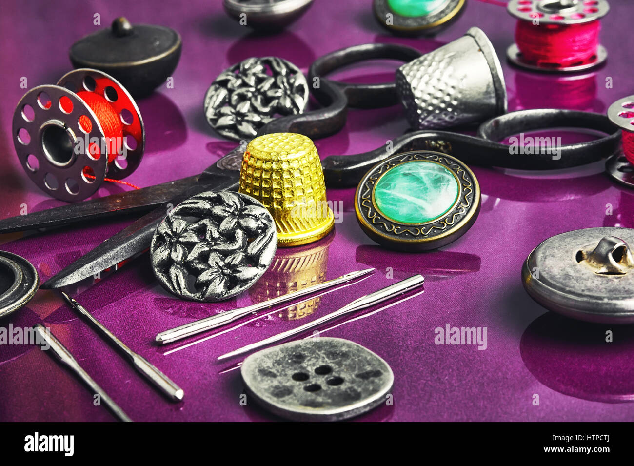 Set of beautiful buttons,sewing needle and bobbin Stock Photo - Alamy