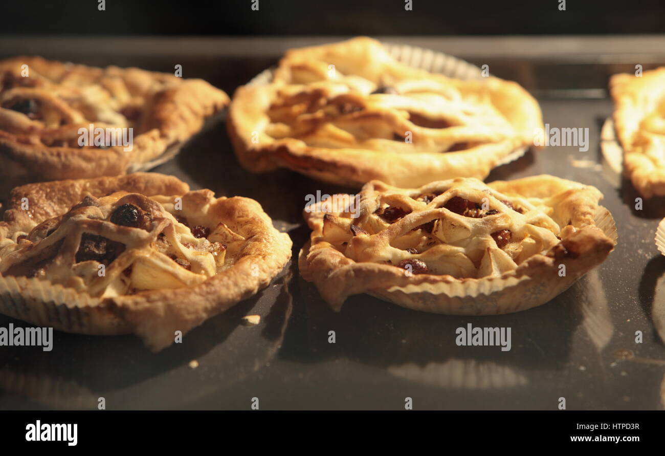 Pies flaky pastry, inside oven, baking tray Baked and rouge Stock Photo