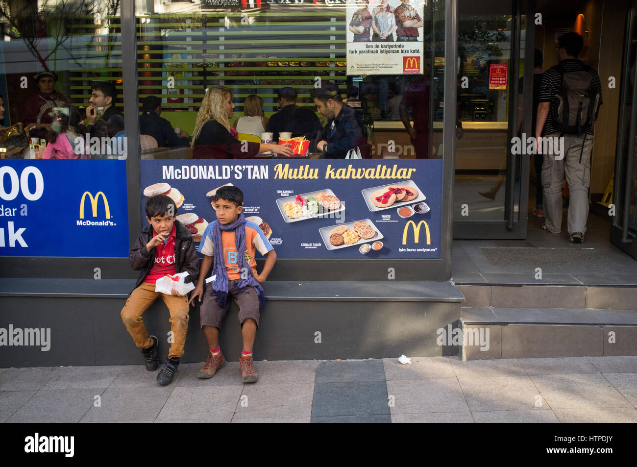 Turkish children in front of the McDonald's restaurant in Istanbul Stock Photo