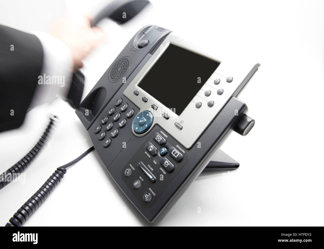 Businessman is picking up / hanging the phone receiver Stock Photo