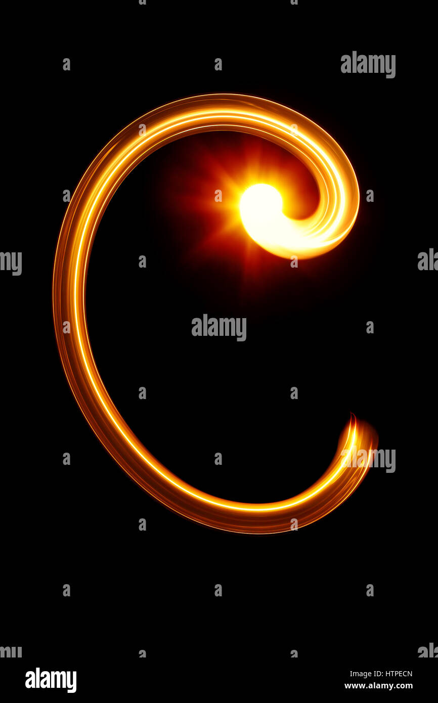 C - Created by light alphabet over black background Stock Photo - Alamy