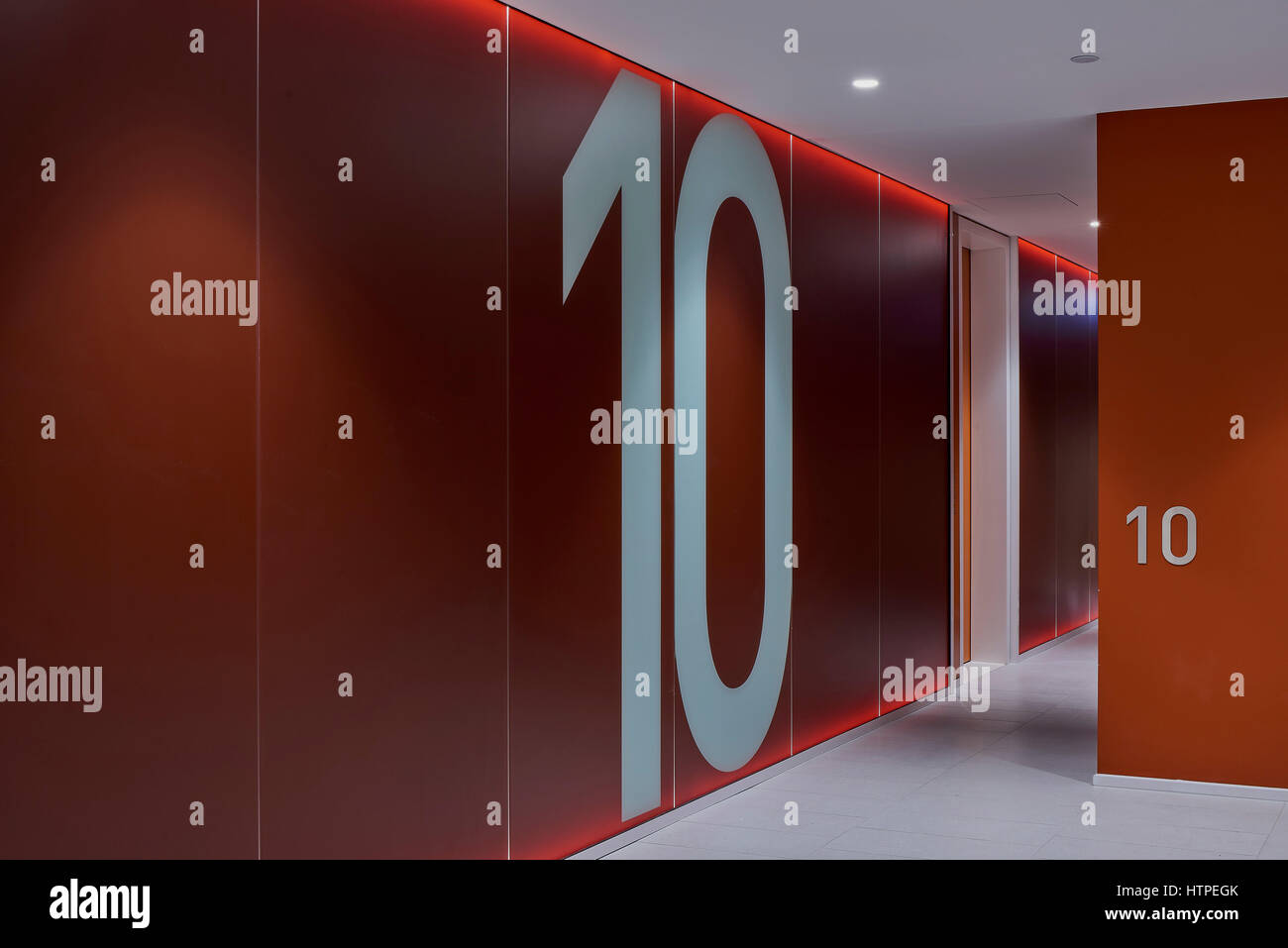 Typical lift lobby and corridor with numbered floor signage. Connor