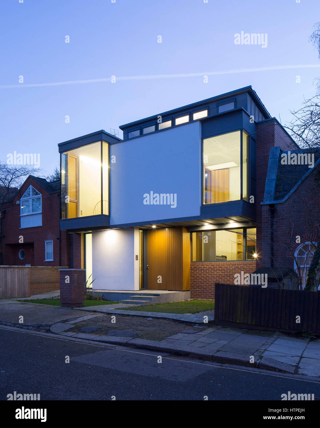 Exterior View at dusk of front of house. Private House, London, United Kingdom. Architect: Panter Hudspith Architects, 2017. Stock Photo