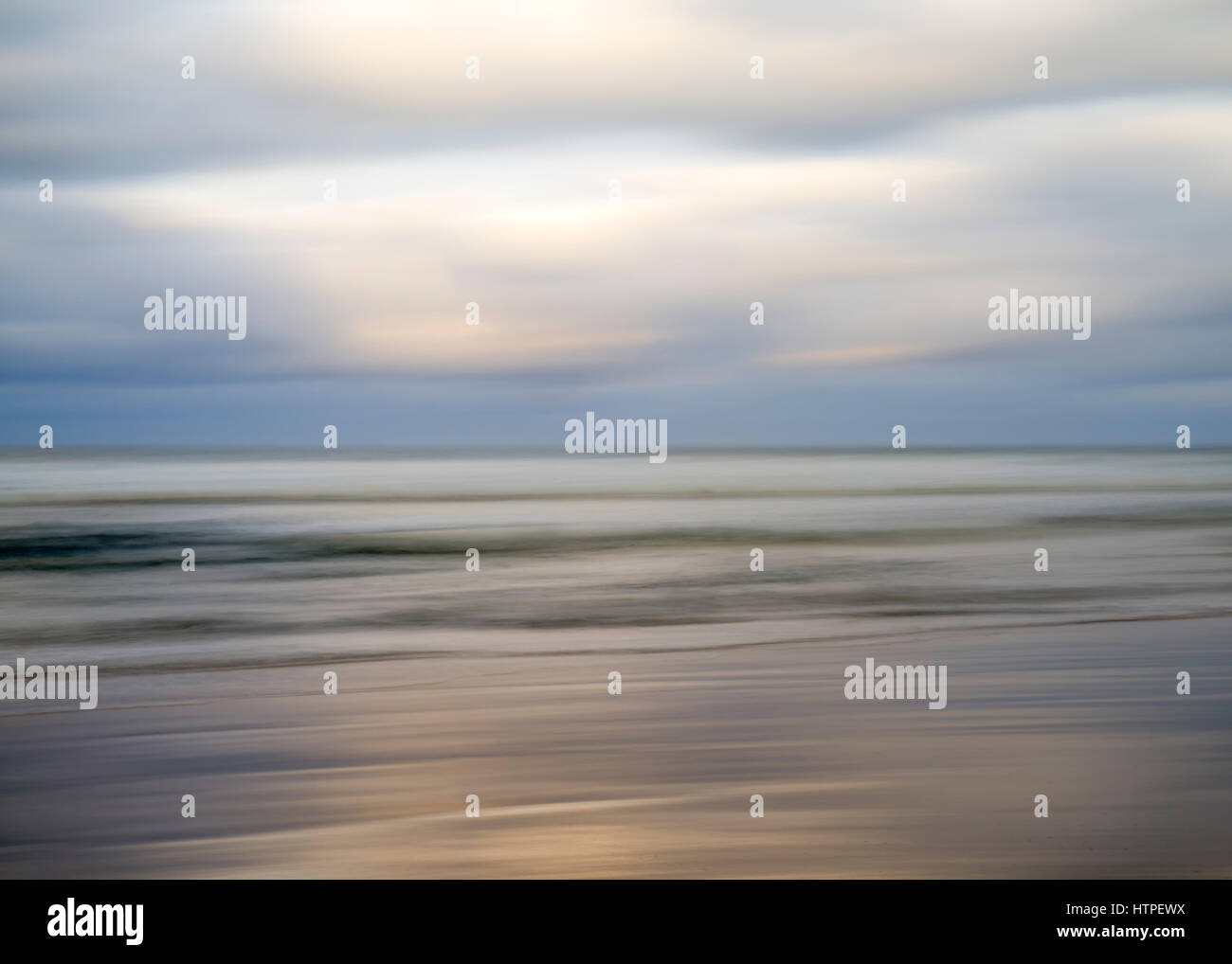 motion blur, de-focused sea, cloudy morning. Stock Photo