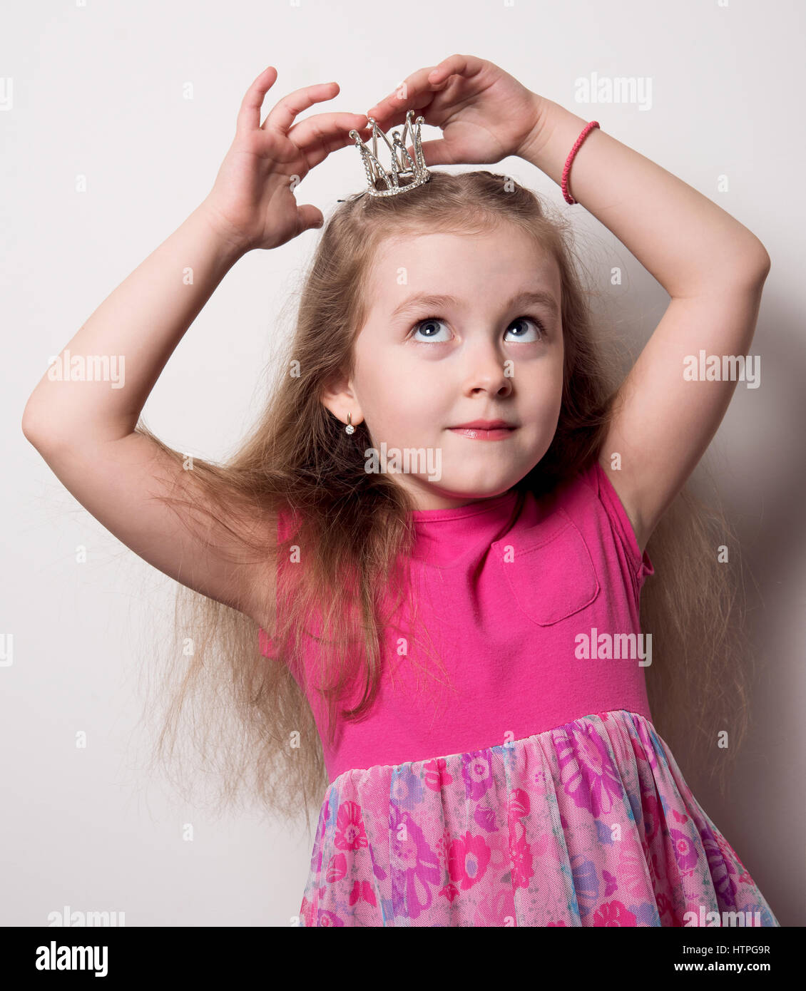 Princess baby girl in a pink dress Stock Photo - Alamy