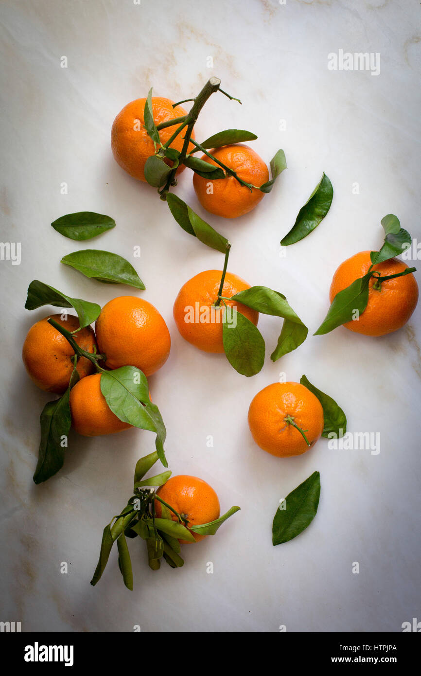 Tangerines with leaves and stem Stock Photo Alamy