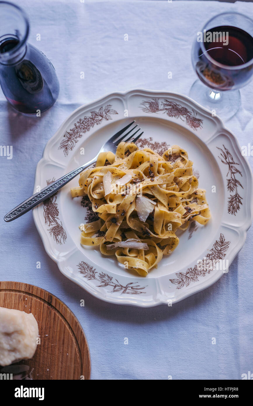 Tagliatelle pasta with black truffle served on a vintage plate Stock Photo