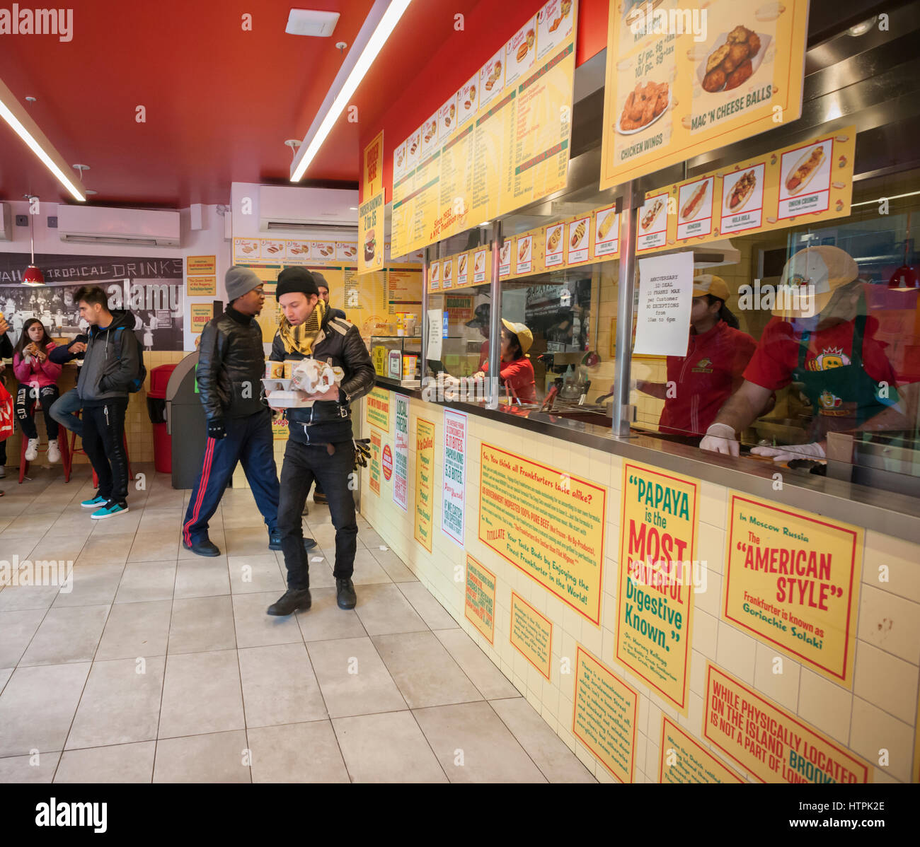 Customers pack the Papaya King store in Downtown Brooklyn in New York