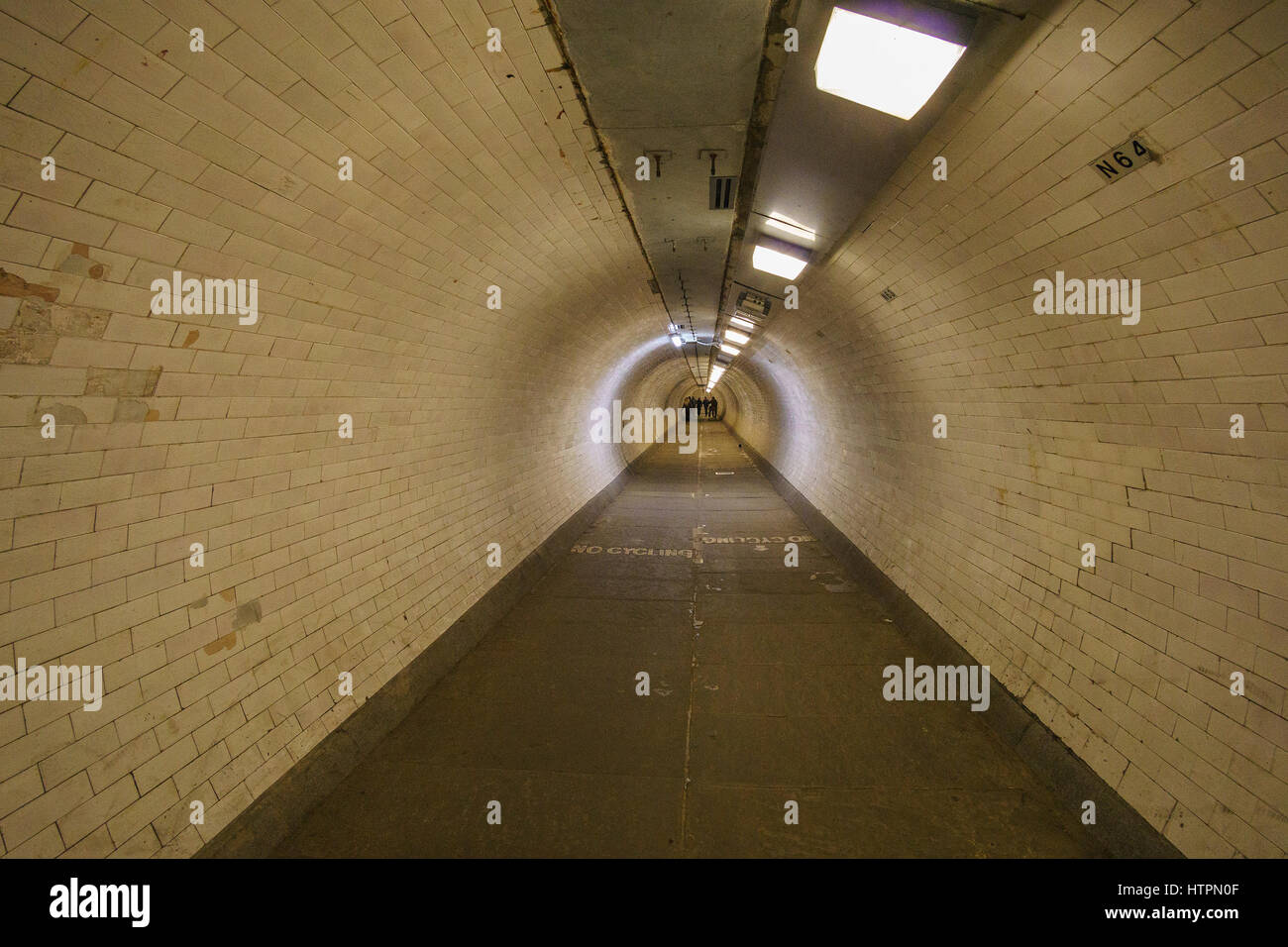 Long vintage tunnel under the river Thames in Greenwich, London
