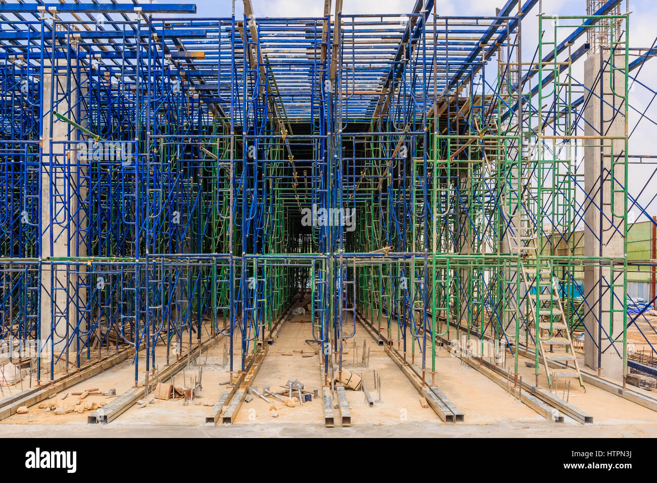 Scaffolding used as the temporary structure to support platform, form work and structure at the construction site. Also used it as a walking platform  Stock Photo