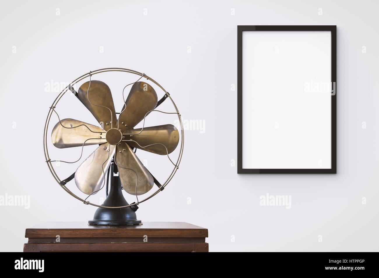blank black picture frame hanging on wall in living room Stock Photo ...