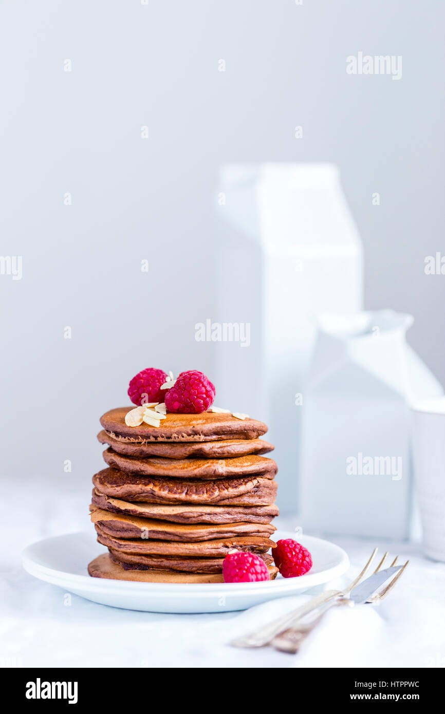 Chocolate Pancakes with Raspberries and Almond Flakes Stock Photo