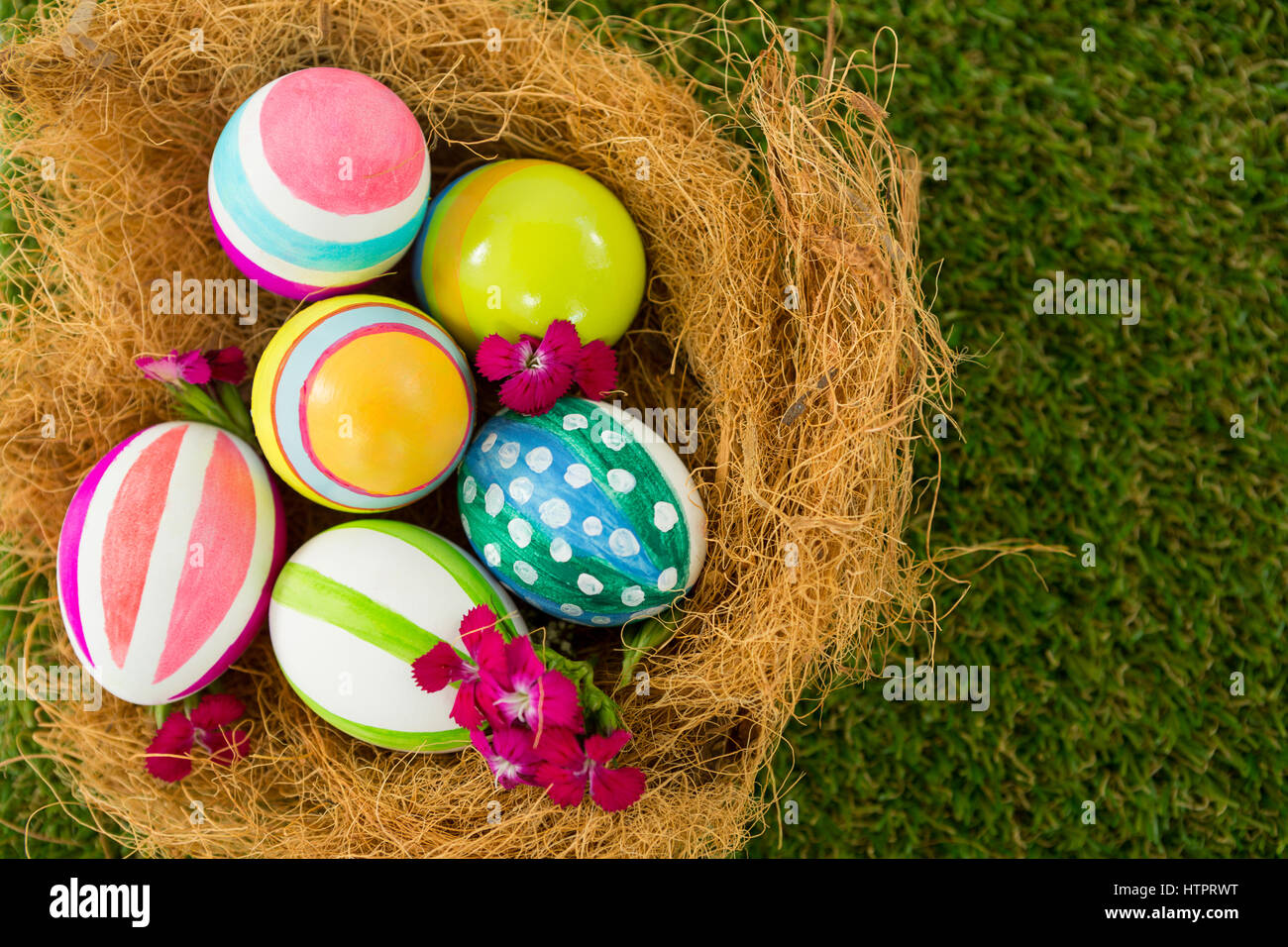 Close-up of painted Easter eggs in the nest Stock Photo - Alamy