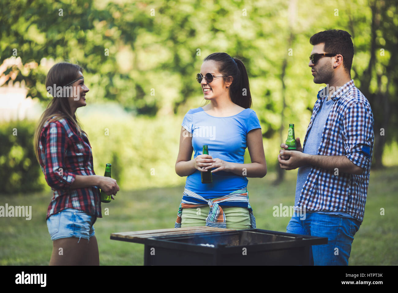 Young people in nature having a bbq party Stock Photo