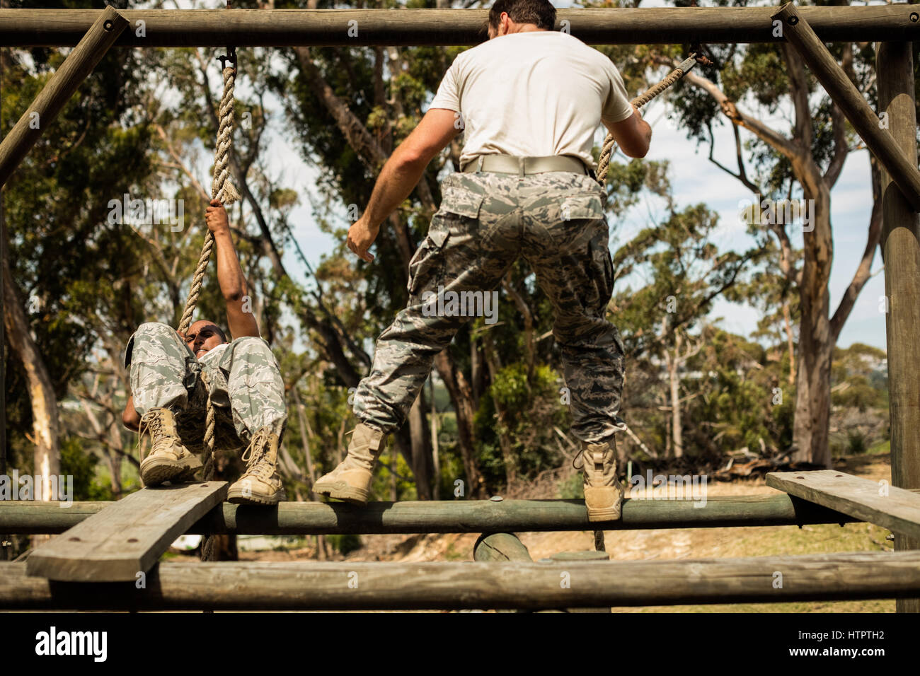 Military soldiers training rope climbing at boot camp Stock Photo Alamy