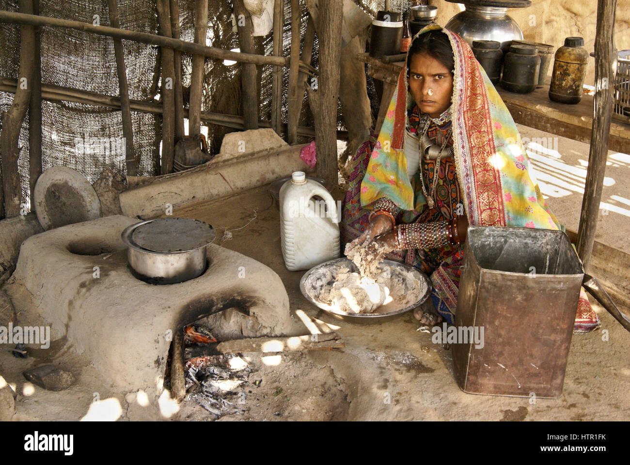 Meghwal Harijan woman making bread in a village near Bhuj, Gujarat