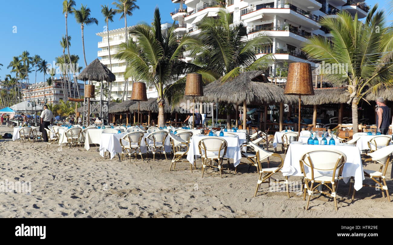 Empty tables at beach restaurant in Puerto Vallarta, Mexico Stock Photo